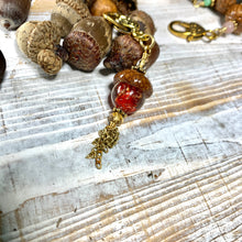 Load image into Gallery viewer, Red Crystal with Gold Flecks Keyring Acorn Charm

