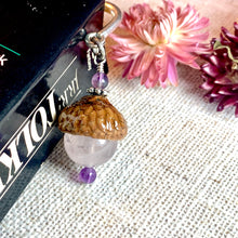 Load image into Gallery viewer, a close up of a book on a table with flowers
