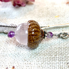 Load image into Gallery viewer, a piece of jewelry sitting on top of a table
