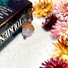 Load image into Gallery viewer, a book and some flowers on a table
